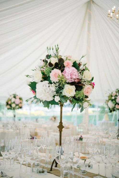 tall arrangements in marquee by Your London Florist